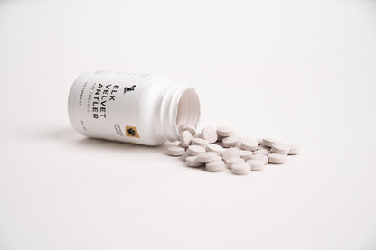 Elk Velvet Antler Pet Tablets White supplement bottle with pills on a white gray background