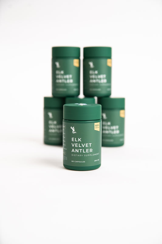 Green containers labeled 'Elk Velvet Antler' on a white background