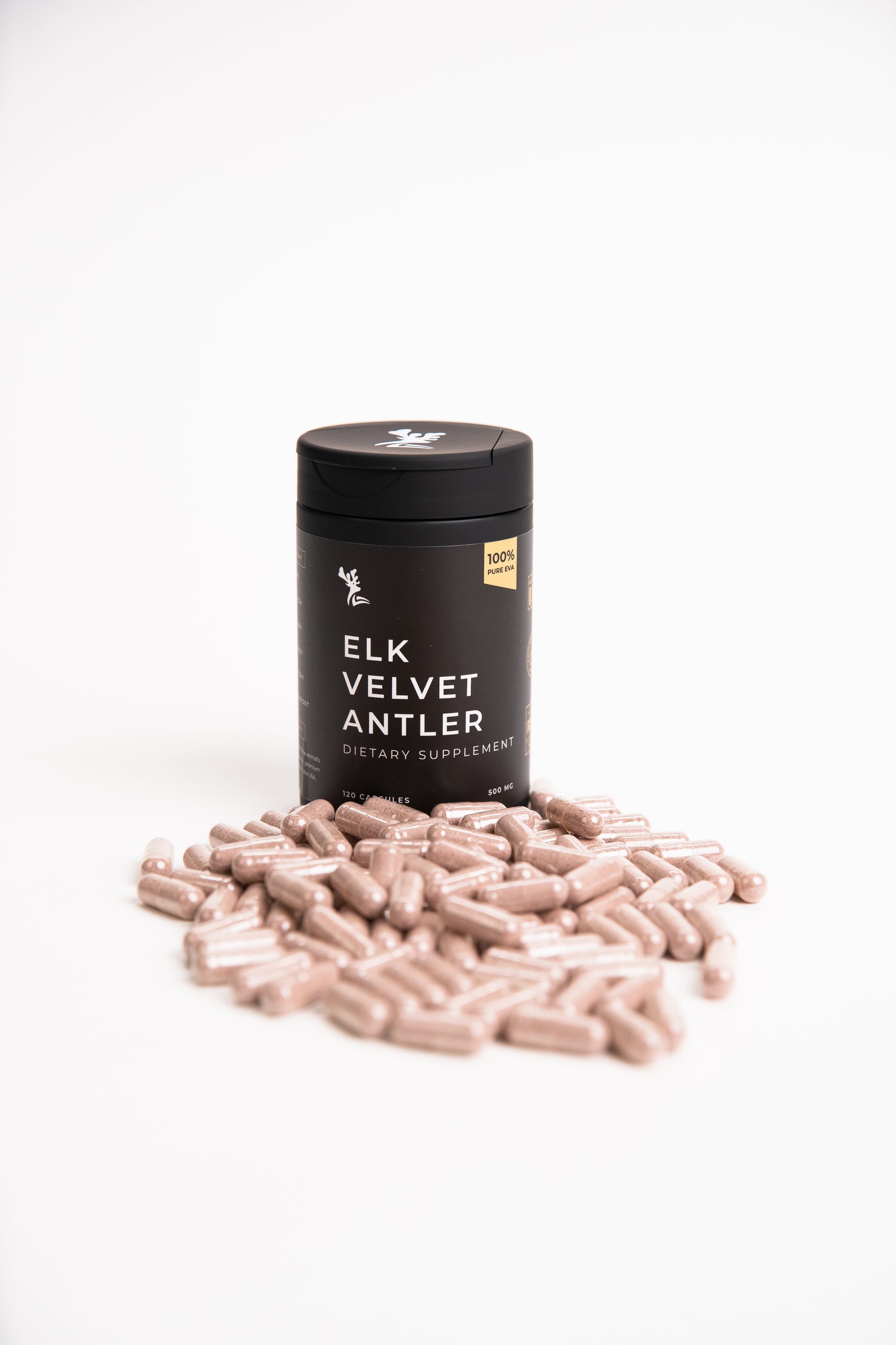 Elk Velvet Antler Dietary Supplement and Capsules in front of a black bottle