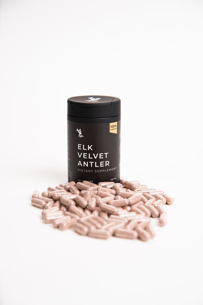 Elk Velvet Antler Dietary Supplement and Capsules in front of a black bottle